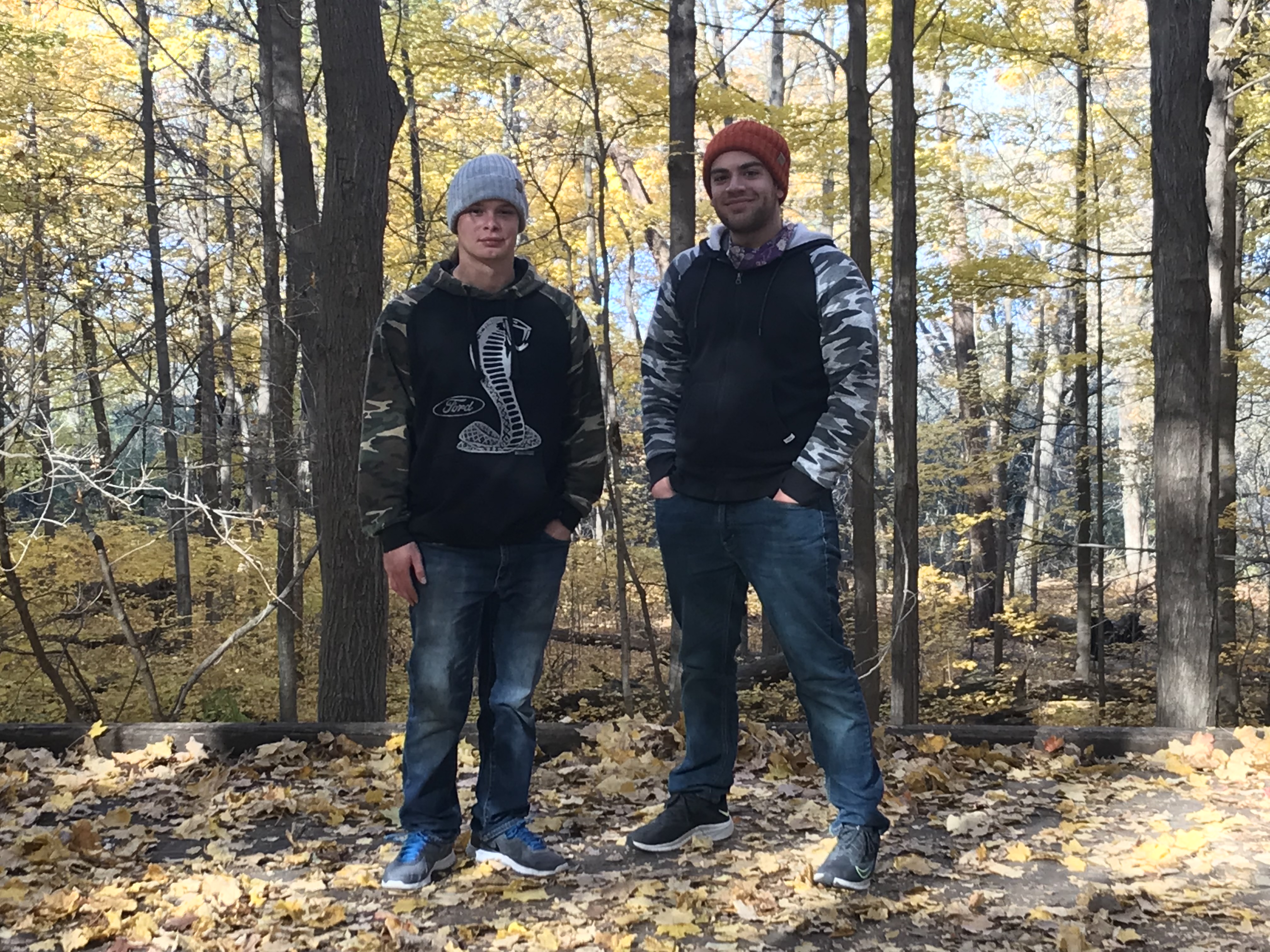 Ryan and Donavyn standing in front of trees in forest