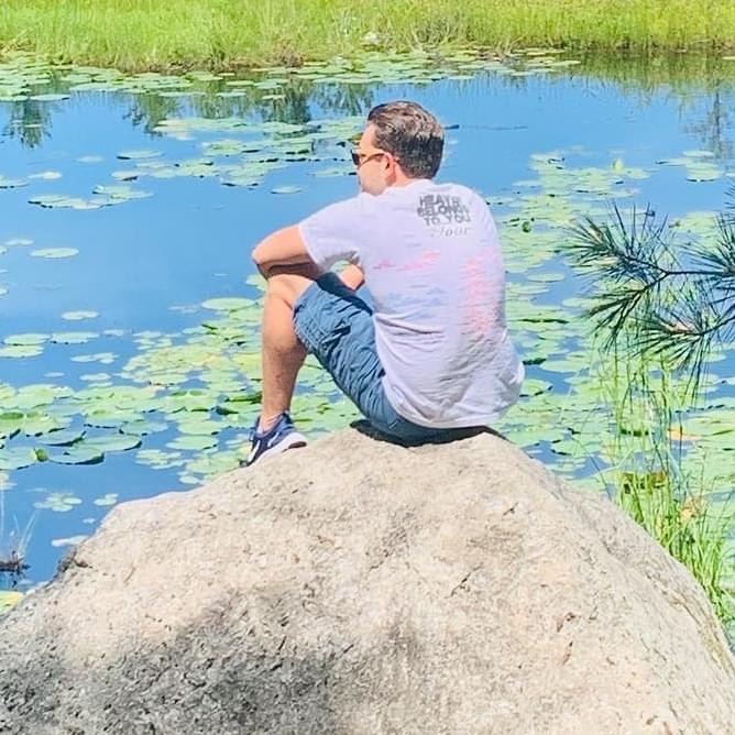 Ryan_sitting_on_rock_at_Bearskin_State_Trail_Minocqua